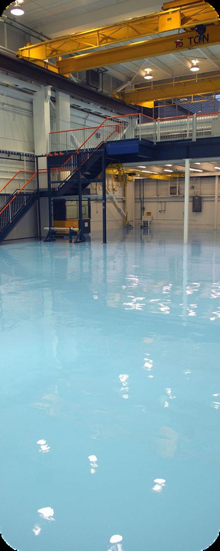 Blue polyurethane floor in an industrial hall with overhead crane